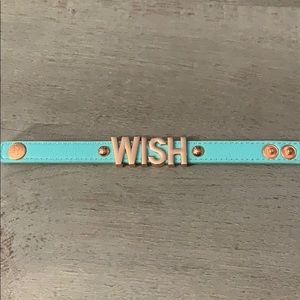 BCBG turquoise leather bracelet with gold letters